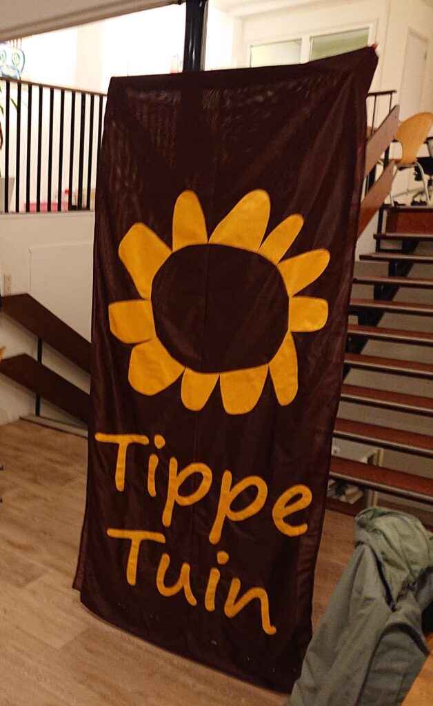 Tippetuin overleg en logo